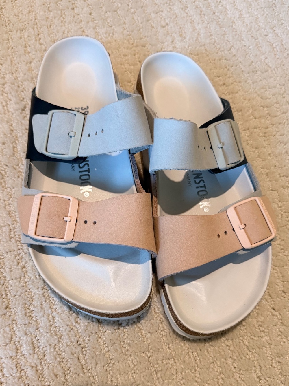 Birkenstock women’s Two-Tone Buckle Sandals in Black, Light Gray and Blush